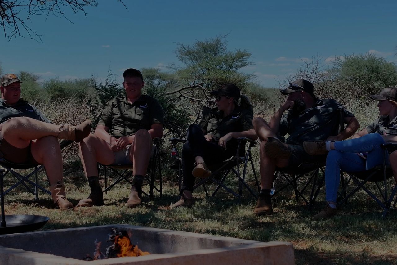 Hunters and guests around the fire