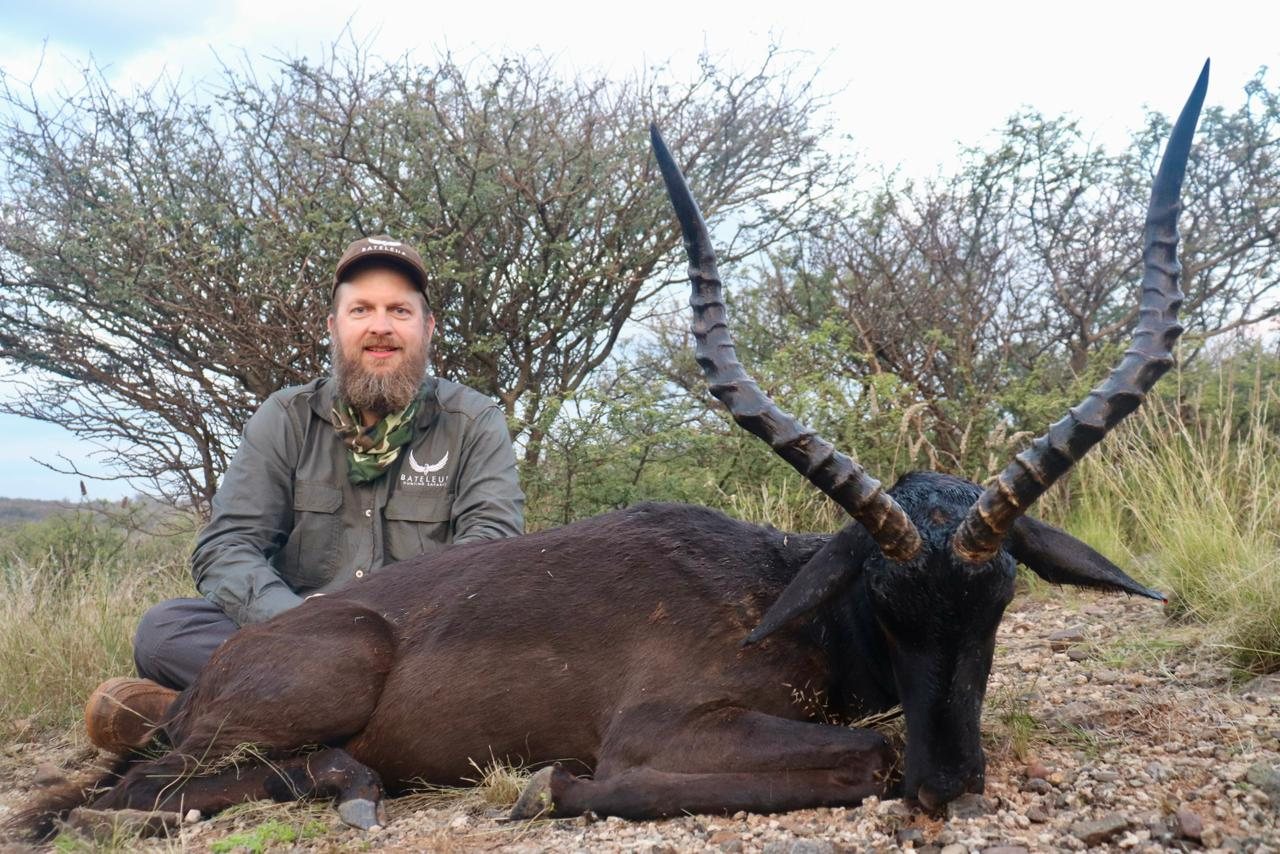 A hunter with a black impala