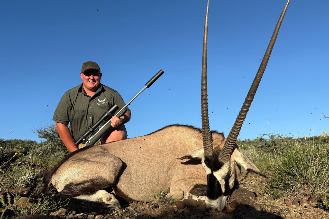 A hunter with his gemsbok trophy