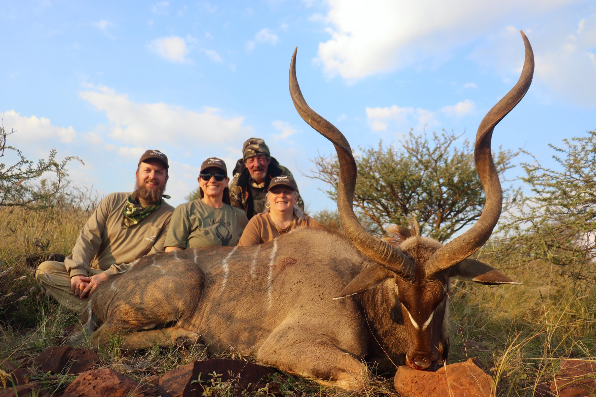 A hunting party with a kudu bull