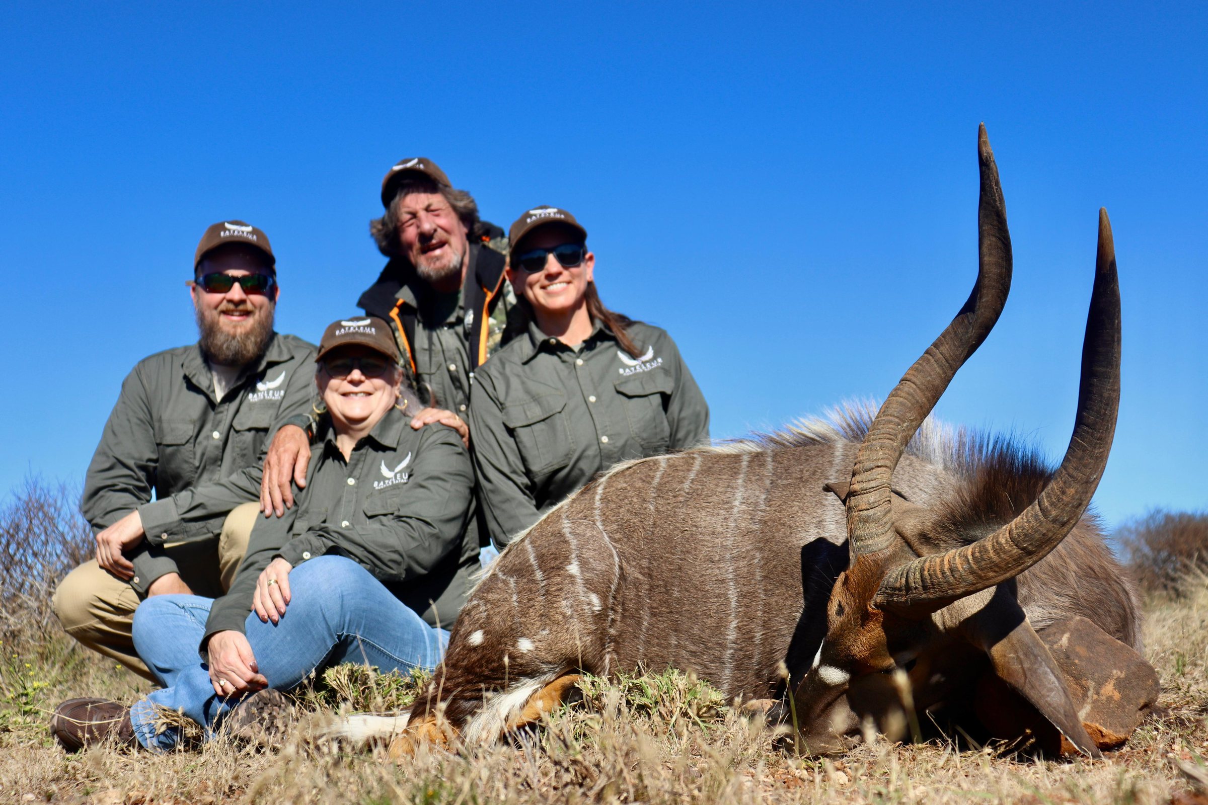 A hunting party with a nyala bull