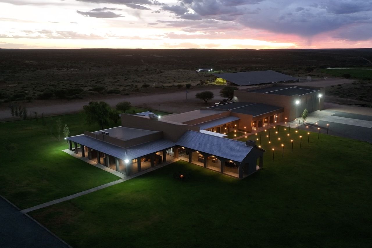 Bateleur Lodge lit up at dusk