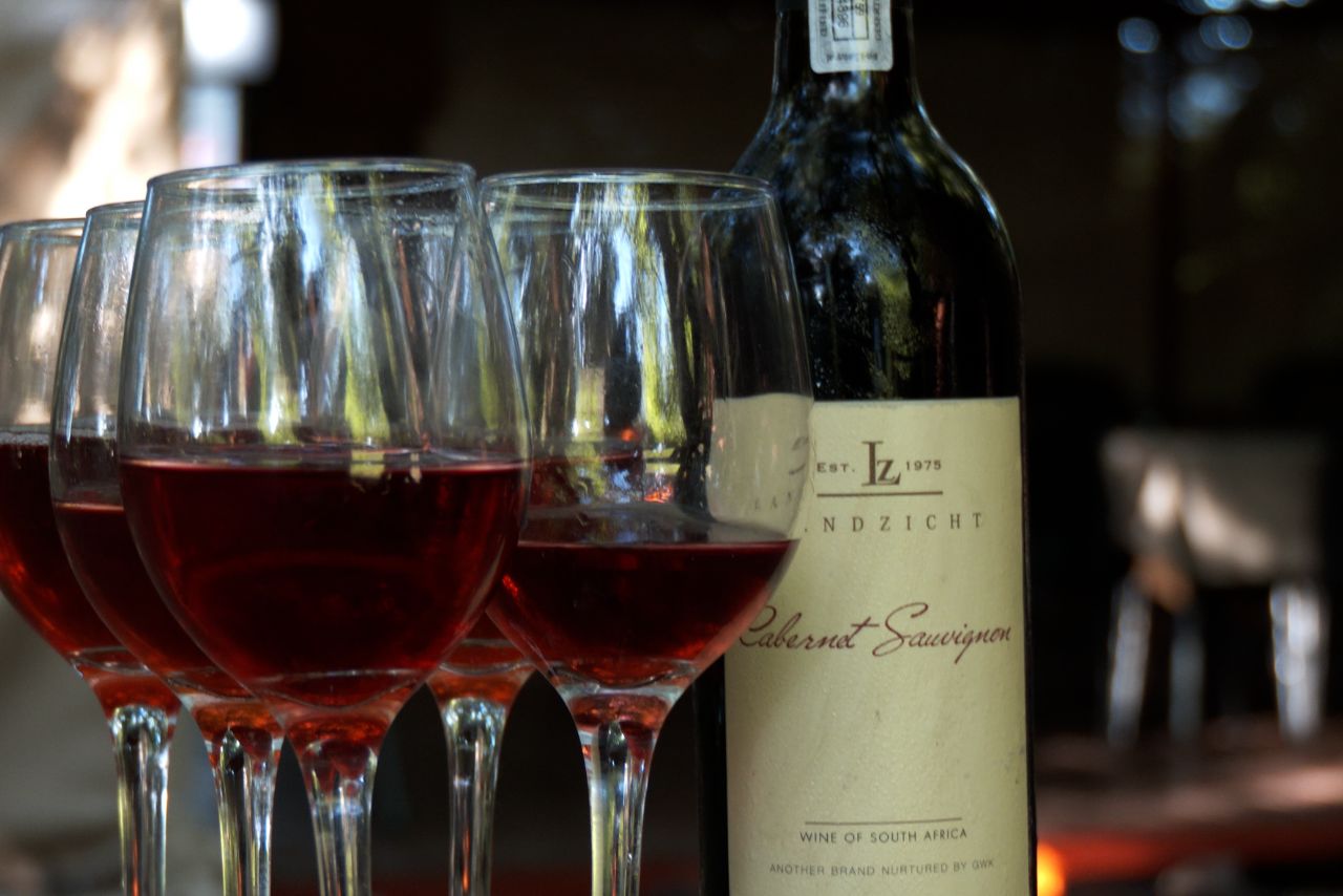Red wine poured beside the fire