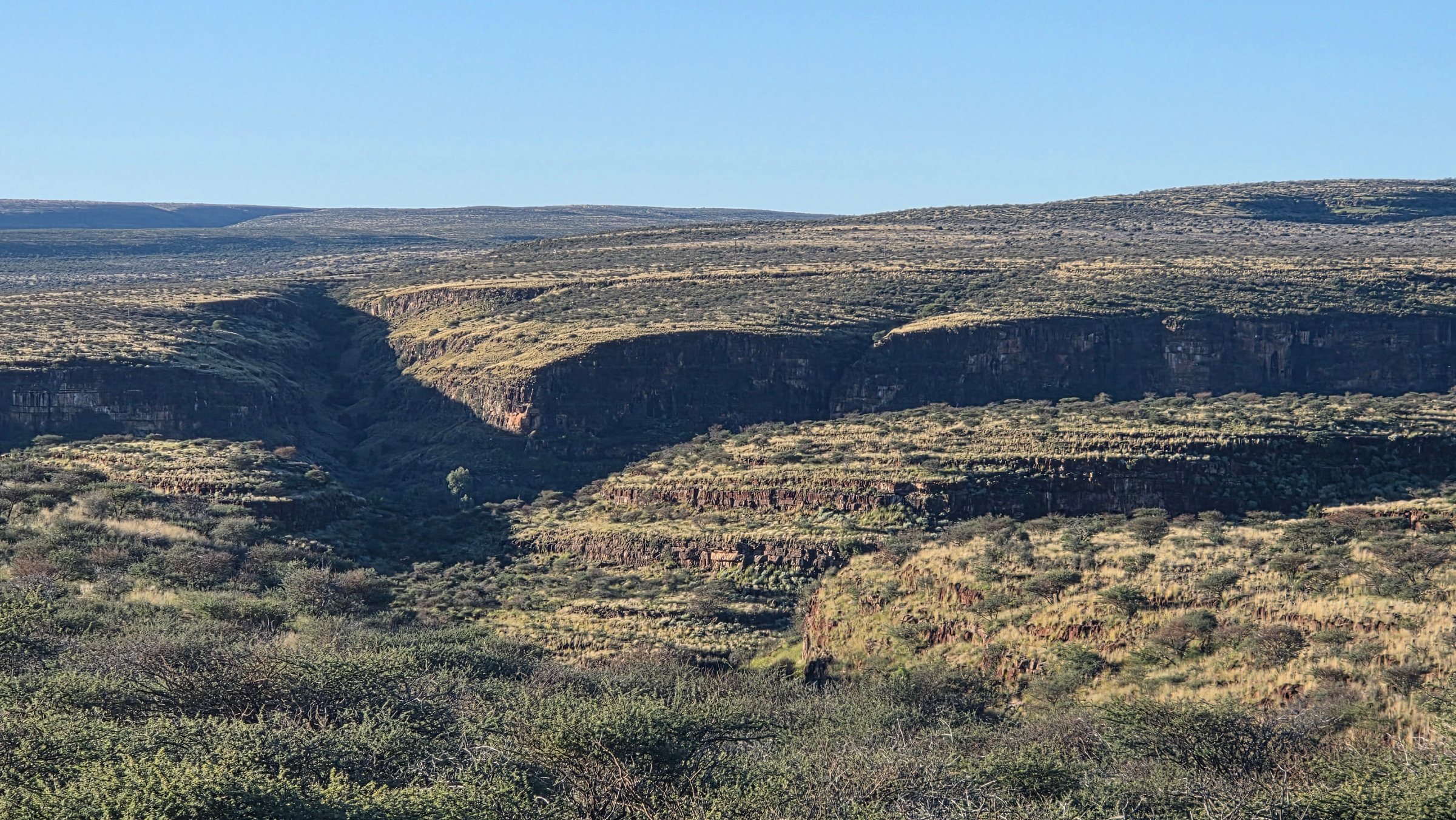 A deep ravine cuts through the plateau