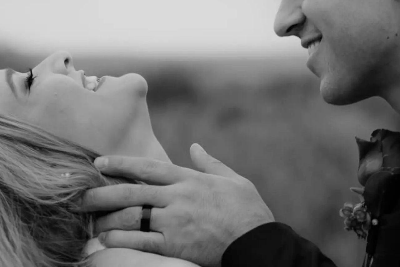 A black-and-white close-up of the couple